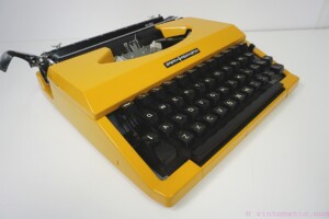 Orange / Yellow 1970s Sperry Remington 10/50 model typewriter