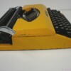 Orange / Yellow 1970s Sperry Remington 10/50 model typewriter