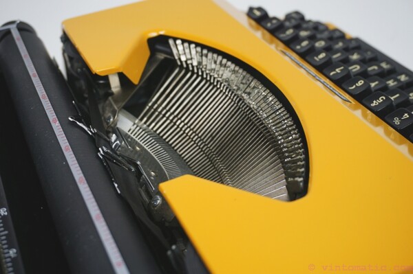 Orange / Yellow 1970s Sperry Remington 10/50 model typewriterOrange / Yellow 1970s Sperry Remington 10/50 model typewriter