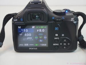 Pentax K-X DSLR camera (12.4 MP) with two lenses