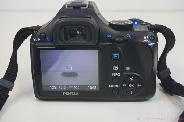 Pentax K-X DSLR camera (12.4 MP) with two lenses