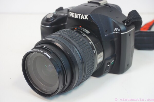 Pentax K-X DSLR camera (12.4 MP) with two lenses