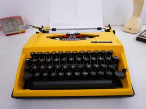 Vintage 1970’s Triumph (Adler) Tippa Portable Typewriter - Yellow, QWERTY Layout with Original Case