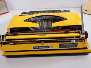 Vintage 1970’s Triumph (Adler) Tippa Portable Typewriter - Yellow, QWERTY Layout with Original Case