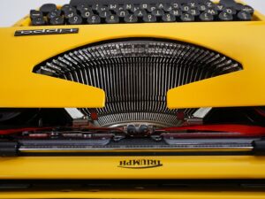 Vintage 1970’s Triumph (Adler) Tippa Portable Typewriter - Yellow, QWERTY Layout with Original Case