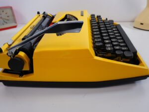 Vintage 1970’s Triumph (Adler) Tippa Portable Typewriter - Yellow, QWERTY Layout with Original Case