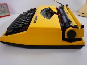 Vintage 1970’s Triumph (Adler) Tippa Portable Typewriter - Yellow, QWERTY Layout with Original Case